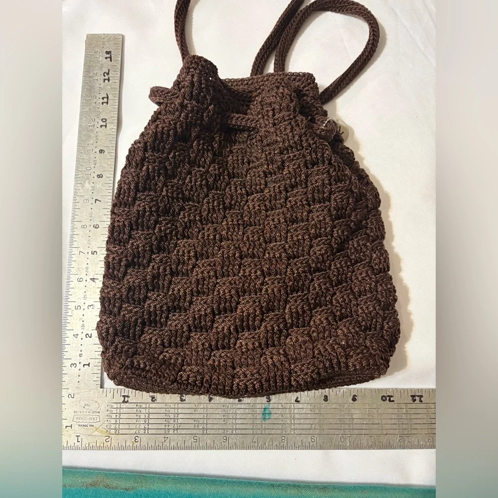 THE SAK women’s Brown Crochet Bucket Bag Backpack Drawstring Tote Purse w/charm‎